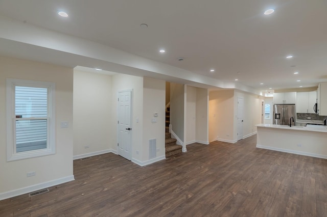 1131 S Ridgeland Ave, Oak Park, IL 60304 - unfurnished living room with recessed lighting, visible vents, and dark wood-type flooring