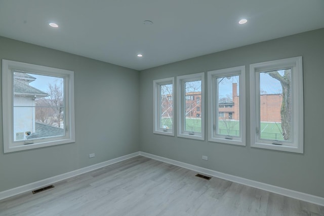 1131 S Ridgeland Ave, Oak Park, IL 60304 - spare room with visible vents, recessed lighting, light wood-style floors, and baseboards