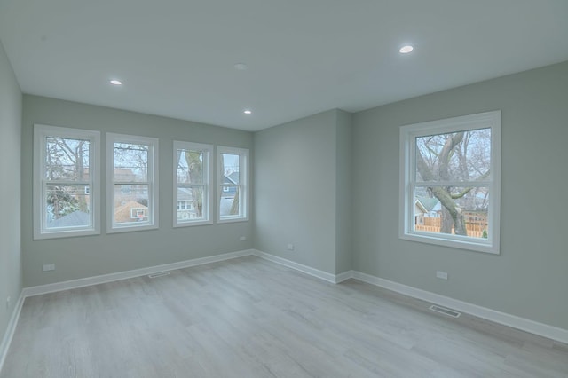 1131 S Ridgeland Ave, Oak Park, IL 60304 - empty room featuring recessed lighting, baseboards, visible vents, and light wood-type flooring