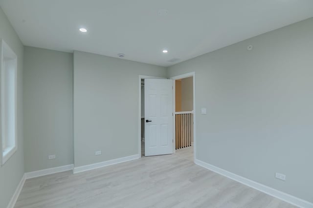 1131 S Ridgeland Ave, Oak Park, IL 60304 - spare room with recessed lighting, light wood-style floors, and baseboards