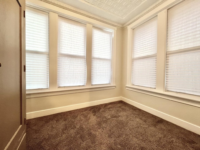 7223 S Paxton Ave, Chicago, IL 60649 - unfurnished room with an ornate ceiling, dark carpet, baseboards, and ornamental molding