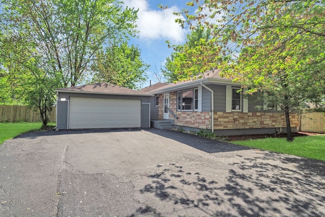 117 Arthur Ave, South Elgin, IL 60177 - ranch-style house featuring fence, stone siding, and a detached garage