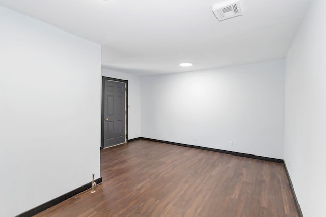 117 Arthur Ave, South Elgin, IL 60177 - spare room featuring baseboards and dark wood-type flooring