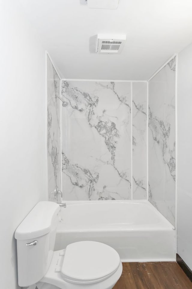 117 Arthur Ave, South Elgin, IL 60177 - bathroom featuring toilet, washtub / shower combination, and wood finished floors