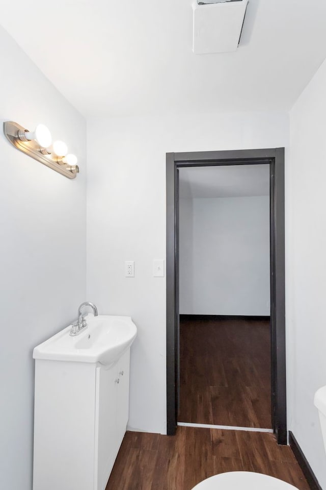 117 Arthur Ave, South Elgin, IL 60177 - half bath featuring wood finished floors, toilet, and vanity