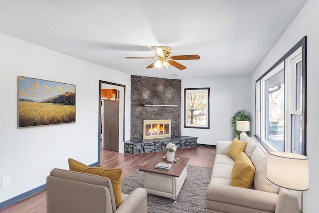 117 Arthur Ave, South Elgin, IL 60177 - living area featuring wood finished floors, ceiling fan, baseboards, and a stone fireplace