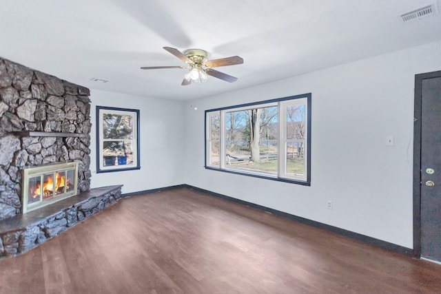117 Arthur Ave, South Elgin, IL 60177 - unfurnished living room with wood finished floors, a ceiling fan, a fireplace, and baseboards