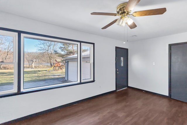 117 Arthur Ave, South Elgin, IL 60177 - unfurnished room with dark wood-style floors, baseboards, and ceiling fan