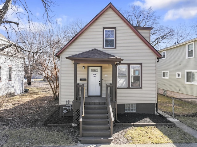 view of front of house featuring fence