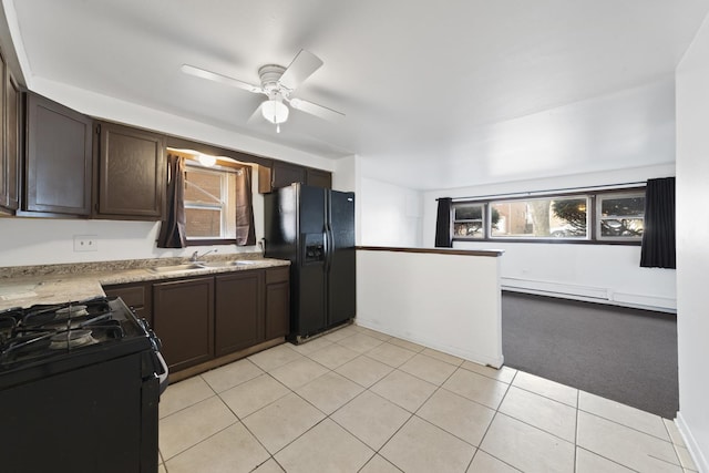 1023 S 11th Ave, Maywood, IL 60153 - kitchen featuring dark brown cabinets, light countertops, black appliances, a ceiling fan, and a sink
