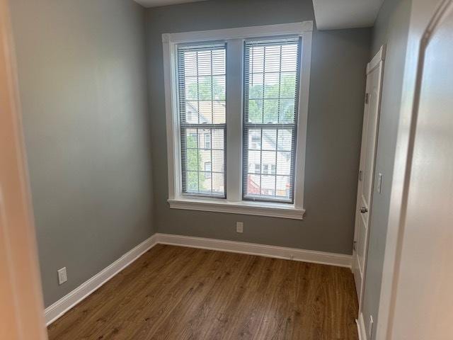 5208 S Paulina St, Chicago, IL 60609 - empty room with plenty of natural light, baseboards, and dark wood-style flooring