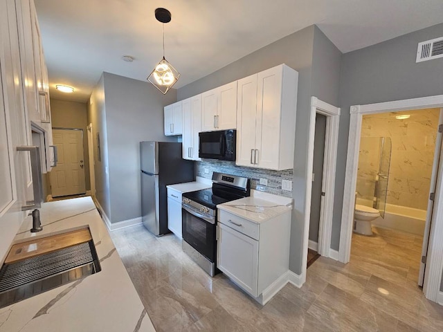 5208 S Paulina St, Chicago, IL 60609 - kitchen featuring baseboards, visible vents, stainless steel appliances, white cabinetry, and backsplash