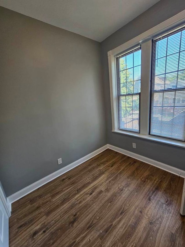 5208 S Paulina St, Chicago, IL 60609 - spare room with baseboards and dark wood-style flooring