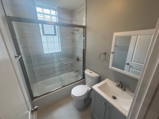 5208 S Paulina St, Chicago, IL 60609 - full bath featuring vanity, toilet, and shower / bath combination with glass door