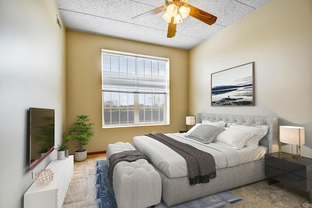 bedroom featuring a ceiling fan and visible vents