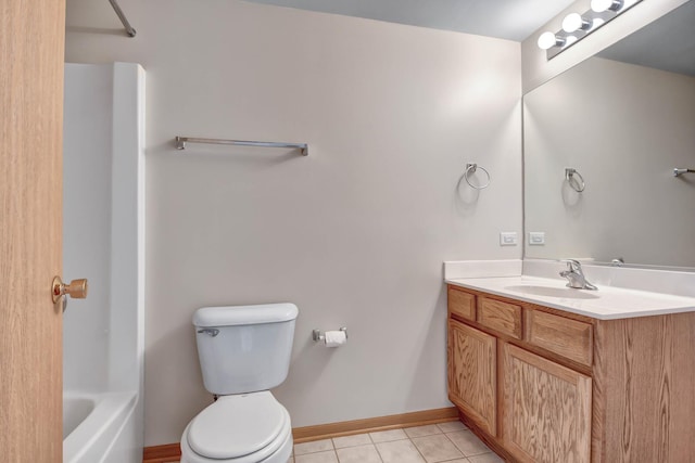 full bathroom with tile patterned flooring, vanity, toilet, baseboards, and shower / washtub combination