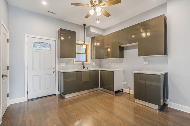 kitchen featuring gray cabinetry, modern cabinets, and a ceiling fan