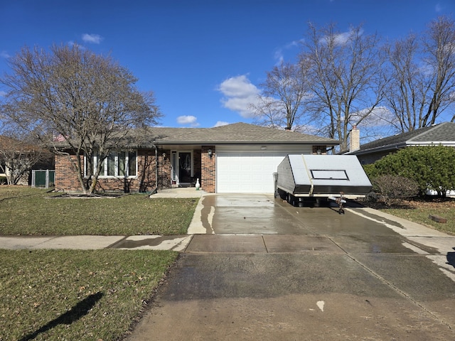 view of front of property with roof with shingles, concrete driveway, an attached garage, brick siding, and a front lawn