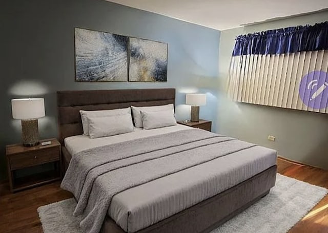 bedroom with wood finished floors