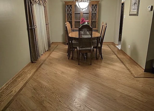 dining area with light wood-style floors