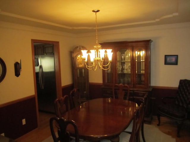 106 Tygert Ln, Dekalb, IL 60115 - dining space with a raised ceiling and a notable chandelier