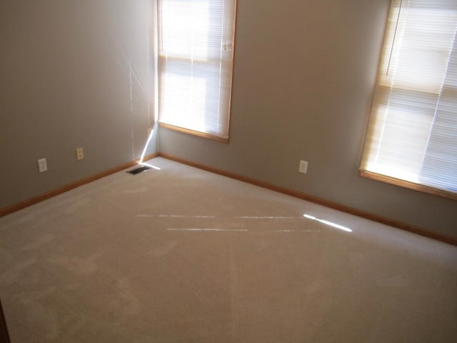 106 Tygert Ln, Dekalb, IL 60115 - carpeted spare room featuring baseboards and visible vents