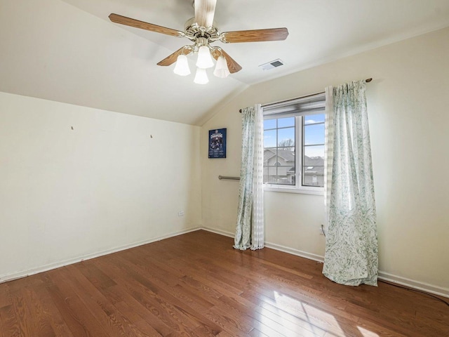 18036 Crystal Ln, Lansing, IL 60438 - spare room featuring visible vents, baseboards, a ceiling fan, lofted ceiling, and hardwood / wood-style floors