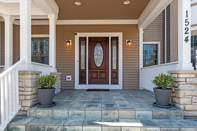 property entrance with covered porch