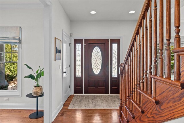 entryway featuring recessed lighting, baseboards, and wood finished floors