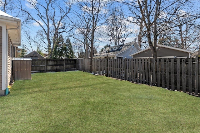 view of yard with a fenced backyard