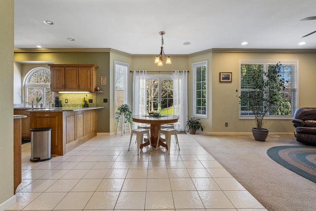 dining space with light colored carpet, light tile patterned flooring, baseboards, and recessed lighting