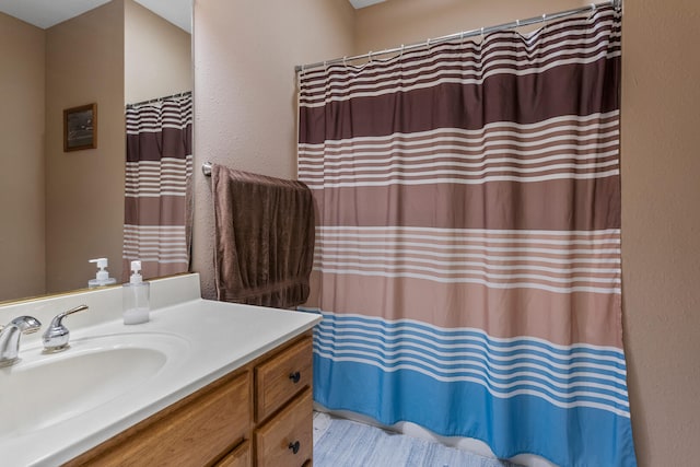 full bathroom featuring vanity