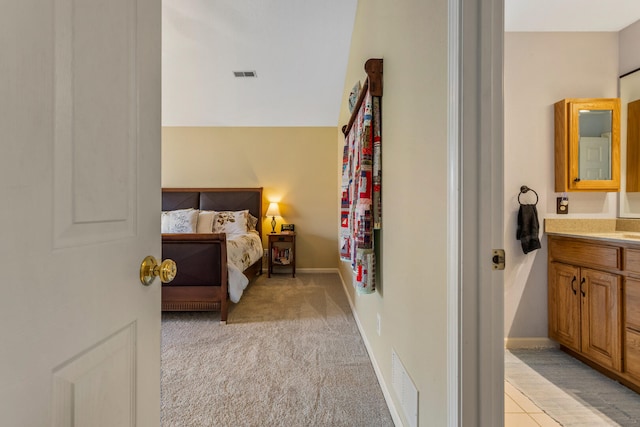 bedroom with light colored carpet, baseboards, and visible vents