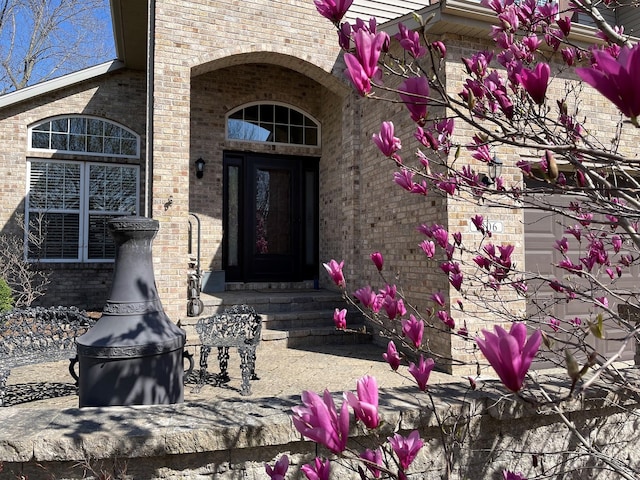 entrance to property with brick siding