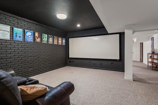 carpeted cinema featuring brick wall
