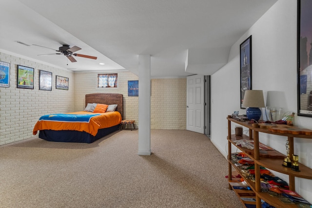 bedroom with brick wall, ceiling fan, and carpet floors