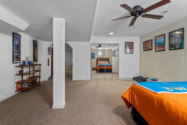 bedroom with visible vents, baseboards, brick wall, ceiling fan, and carpet