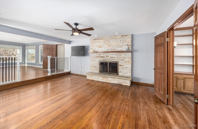 4 Auburn Ln, Barrington Hills, IL 60010 - unfurnished living room with ceiling fan, wood finished floors, and a fireplace