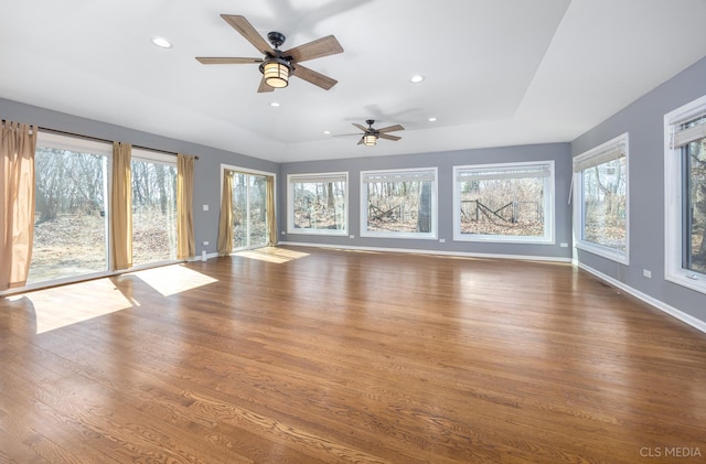 4 Auburn Ln, Barrington Hills, IL 60010 - unfurnished living room with dark wood-type flooring, a raised ceiling, ceiling fan, and recessed lighting