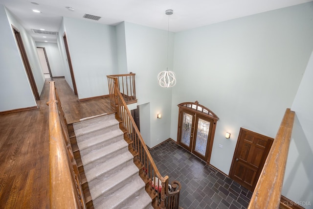 4 Auburn Ln, Barrington Hills, IL 60010 - foyer with french doors, a chandelier, stairs, and recessed lighting