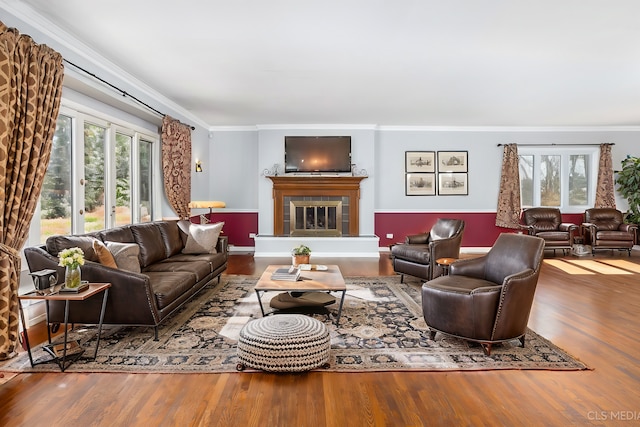 4 Auburn Ln, Barrington Hills, IL 60010 - living room featuring wood finished floors, plenty of natural light, a glass covered fireplace, and ornamental molding