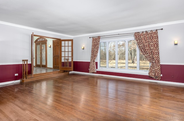 4 Auburn Ln, Barrington Hills, IL 60010 - unfurnished living room featuring wood finished floors, ornamental molding, and a wainscoted wall