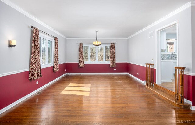 4 Auburn Ln, Barrington Hills, IL 60010 - unfurnished dining area featuring wood finished floors and crown molding