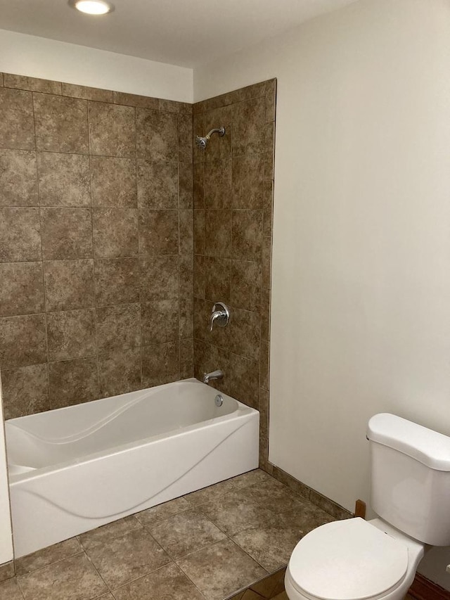 bathroom with tile patterned floors, toilet, and shower / washtub combination