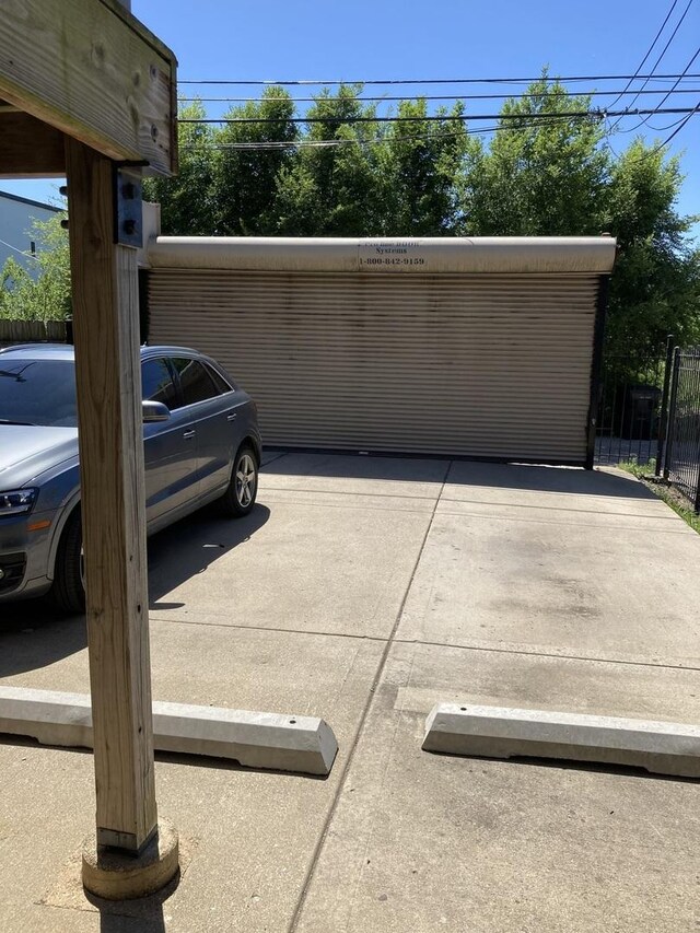 garage featuring fence