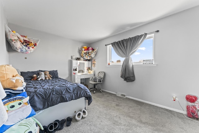 bedroom with visible vents, baseboards, and carpet flooring