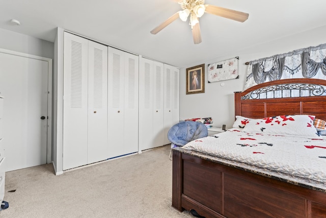 bedroom with light carpet and a ceiling fan