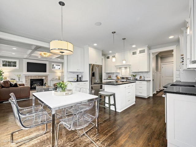 513 W Chicago Ave, Hinsdale, IL 60521 - kitchen featuring high end fridge, dark countertops, white cabinetry, recessed lighting, and a kitchen island