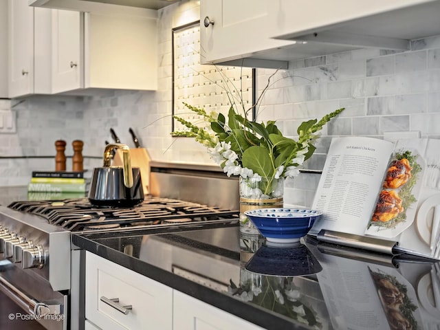 513 W Chicago Ave, Hinsdale, IL 60521 - kitchen with tasteful backsplash, gas range, white cabinets, and dark countertops