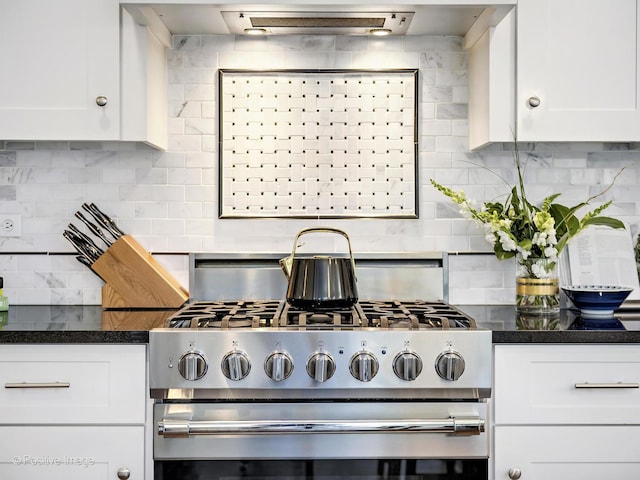 513 W Chicago Ave, Hinsdale, IL 60521 - kitchen with stainless steel range with gas stovetop, backsplash, white cabinetry, and dark countertops
